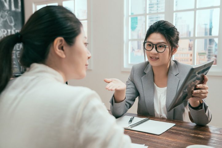 Accountant reviewing figures with a client
